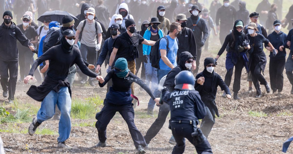 Police confront radical activists in a forest near the Tesla Gigafactory electric car factory in Germany on Friday.