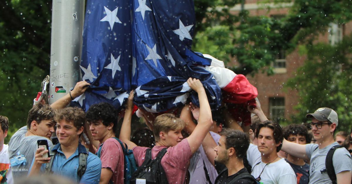 Group of Students Protect American Flag Amidst Angry Mob: Expressing Patriotism
