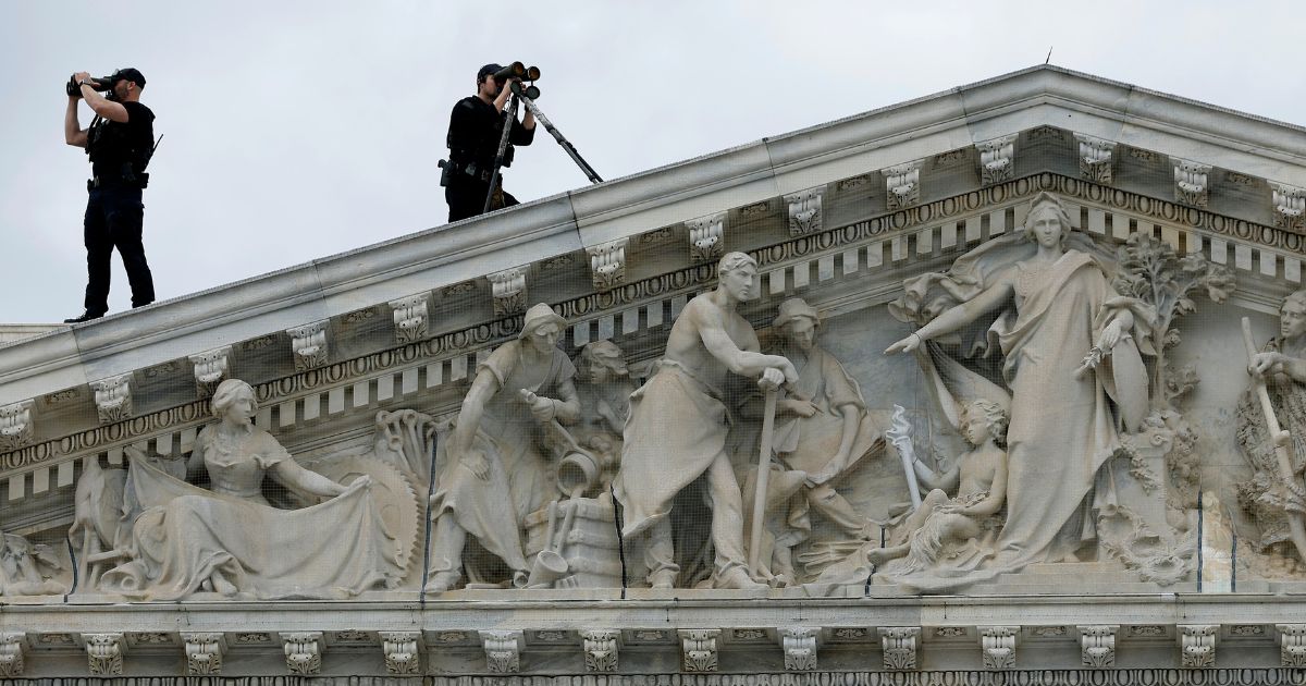 Members of the U.S. Secret Service Counter-Sniper team set up watch from the roof of the House of Representatives in Washington, D.C., as President Joe Biden arrives at the U.S. Capitol in a file photo from March 15, 2023.