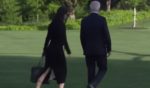 While walking to Marine One on Friday, a White House aid quickly moved from one side of President Joe Biden to the other, in an apparent attempt to shield him from the press.