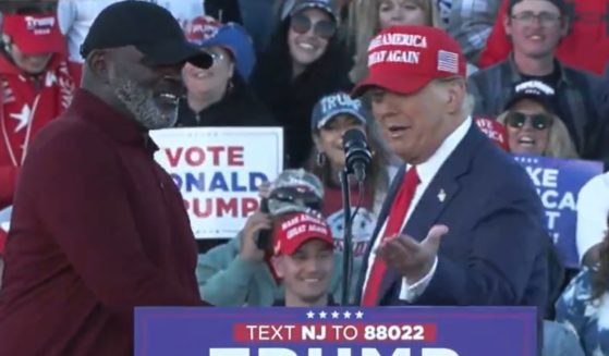 Former President Donald Trump, right, greets former NFL star Lawrence Taylor during a campaign event Saturday in Wildwood, New Jersey.