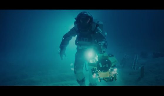A man walking on the bottom of the ocean in a diver suit in the remaster to James Cameron's classic film "The Abyss."