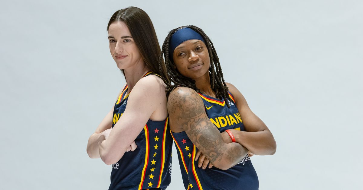 Caitlin Clark, left, and Erica Wheeler pose during the Indiana Fever's media-day activities Wednesday at Gainbridge Fieldhouse in Indianapolis.