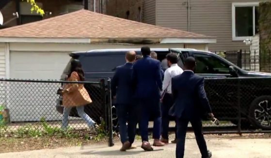 A video from Chicago media appears to show Mayor Brandon Johnson fleeing reporters and preparing to get into a vehicle as they try to ask him questions about fallen officer Luis Huesca. Johnson's office said, however: “That isn’t Mayor Brandon Johnson in the video."