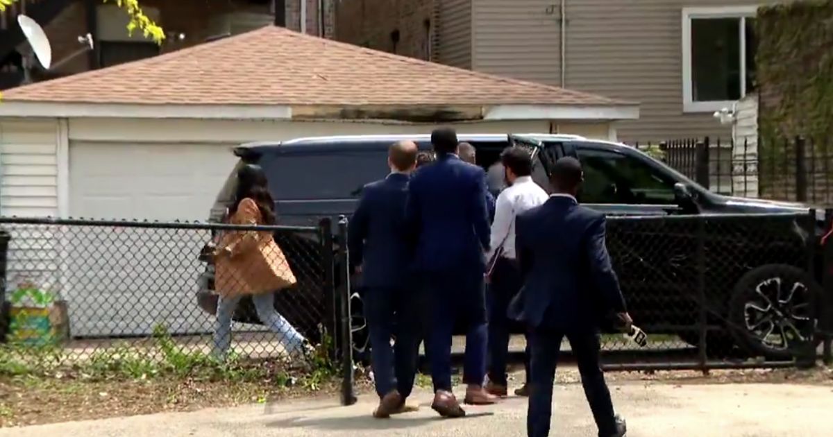 A video from Chicago media appears to show Mayor Brandon Johnson fleeing reporters and preparing to get into a vehicle as they try to ask him questions about fallen officer Luis Huesca. Johnson's office said, however: “That isn’t Mayor Brandon Johnson in the video."