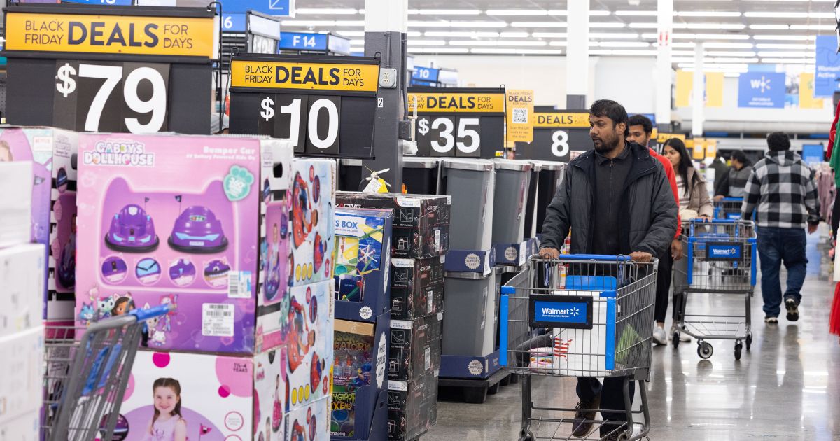 Shoppers walk the aisles of Walmart for Black Friday deals in Dunwoody, Georgia, on Nov. 25, 2022.