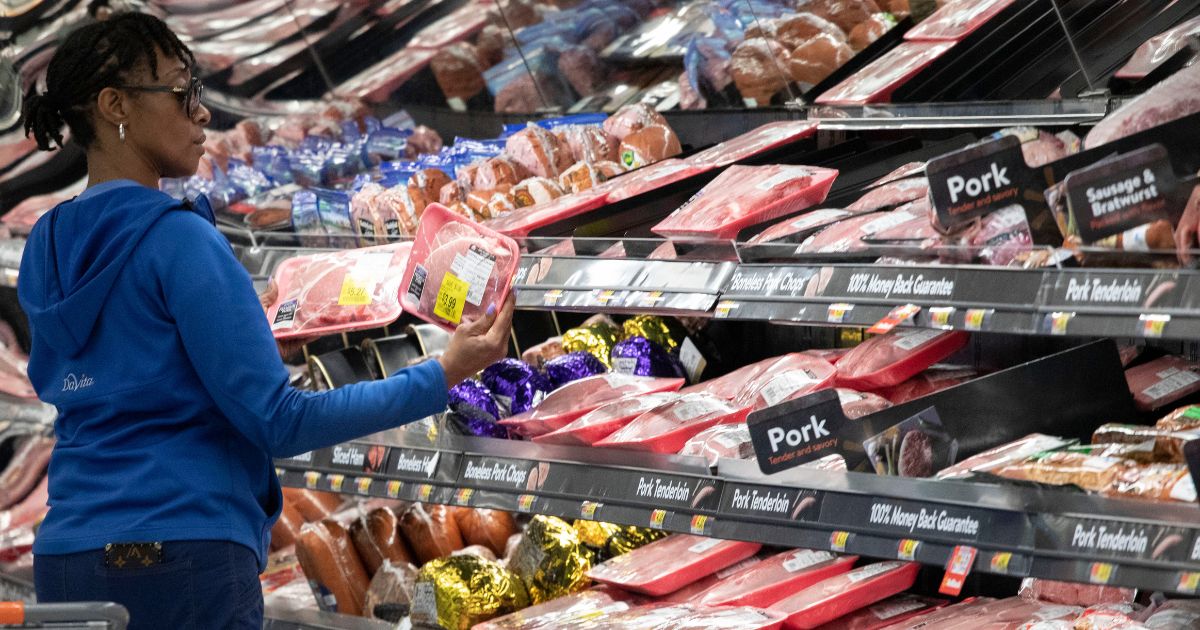 A customer shops at the meat counter at a Walmart in Levittown, New York, on April 24, 2019.