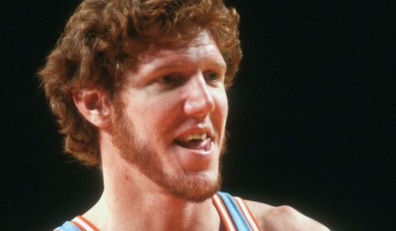 Bill Walton of the San Diego Clippers looks on against the Detroit Pistons during an NBA basketball game circa 1980 at the Pontiac Silverdome in Michigan.
