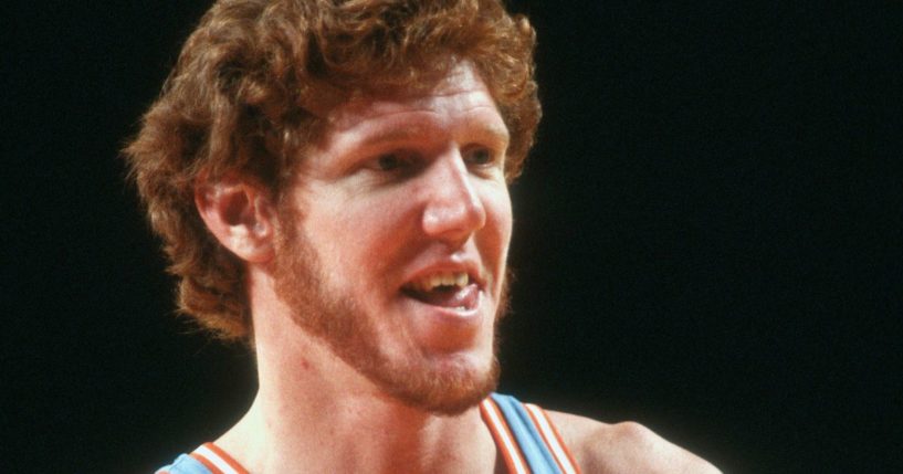 Bill Walton of the San Diego Clippers looks on against the Detroit Pistons during an NBA basketball game circa 1980 at the Pontiac Silverdome in Michigan.