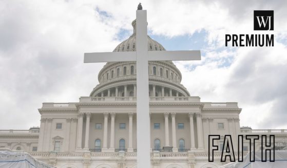 Members of the Christian Defense Coalition set up a 15-foot tall cross before the start of an outdoor Good Friday service on the grounds of the U.S. Capitol in Washington, D.C., on April 10, 2020.