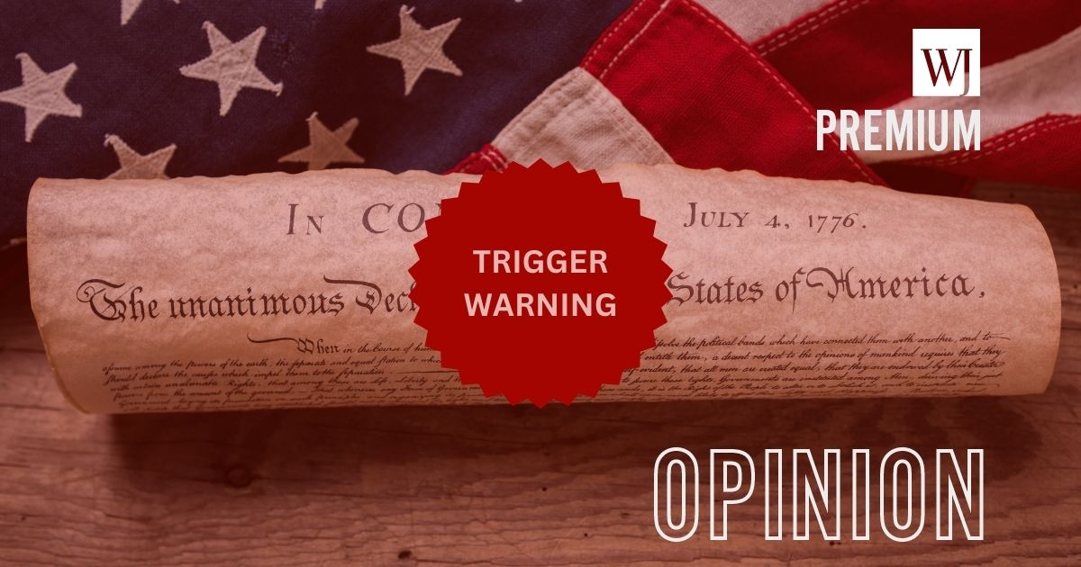 The United States Declaration of Independence is rolled into a scroll in front of the American flag, with "Trigger Warning" written over it.