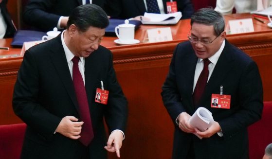 Xi Jinping chatting after the opening session of the National People's Congress in Beijing