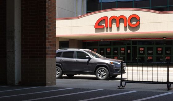 A sign hangs outside of an AMC theater on June 1, 2021 in Skokie, Illinois.
