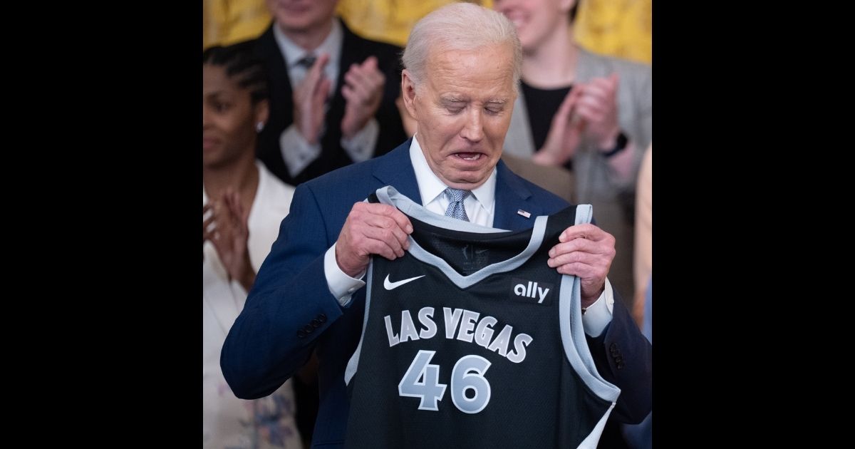 Las Vegas Aces forward A'ja Wilson (not pictured) presents a jersey to U.S. President Joe Biden during a ceremony to celebrate the WNBA Champion Las Vegas Aces in the East Room of the White House on May 9, 2024 in Washington, DC.