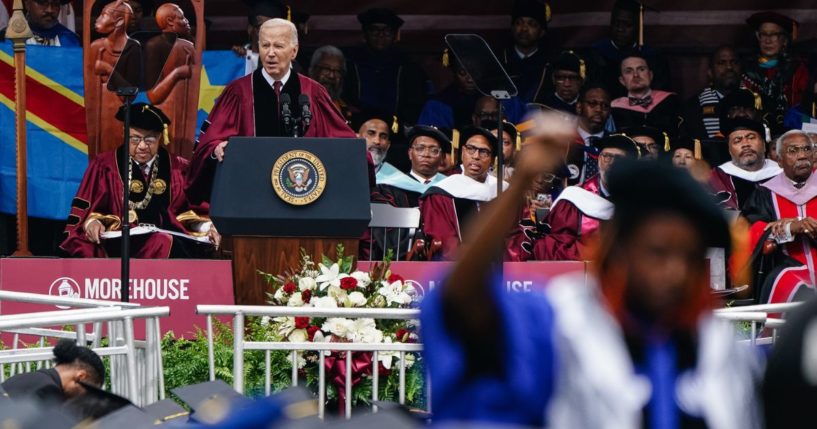 U.S. President Joe Biden speaks at the Morehouse College Commencement as a faculty member stands and faces away from the stage in protest of the Israel-Hamas war on May 19, 2024 in Atlanta, Georgia.