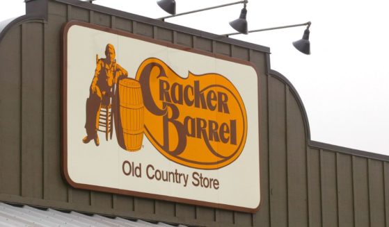 A Cracker Barrel Old Country Store sign is visible atop one of its restaurant stores April 12, 2002 in Naperville, IL.