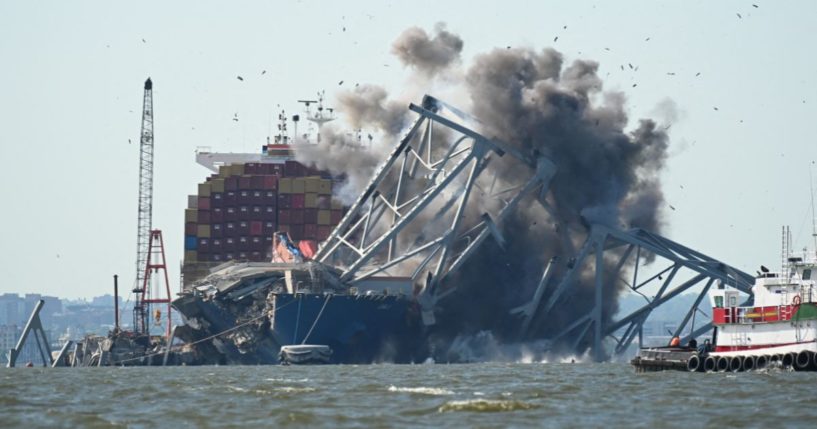 Crews conduct a controlled demolition of a section of the Francis Scott Key Bridge resting on the Dali container ship in Baltimore on Monday.