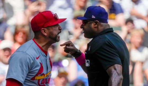 St. Louis Cardinals manager Oliver Marmol argues with home plate umpire Alan Porter during the third inning of the Cardinals game against the Milwaukee Brewers on Sunday.