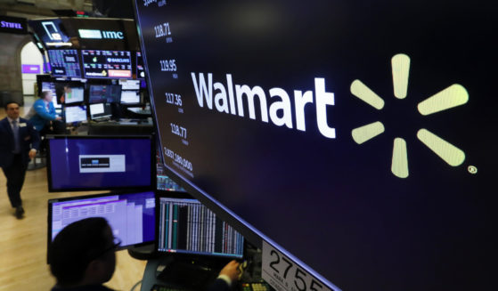 In this Feb. 18, 2020 file photo, the logo for Walmart appears above a trading post on the floor of the New York. Walmart has ended a partnership with Capital One that made the banking company the exclusive issuer of Walmart’s consumer credit cards. The companies announced the change in a joint statement Friday, May 24, 2024.