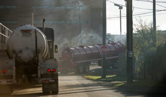 Tractor-trailers carry fresh water to natural gas wells in Williamsport, Pennsylvania, in a 2012 file photo.