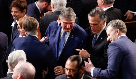 U.S. Sen. Joe Manchin (D-WV) and Sen. Mitt Romney (R-UT) talk prior to the start of President Joe Biden's State of the Union address during a joint meeting of Congress in the House chamber at the U.S. Capitol on March 7, 2024 in Washington, DC.