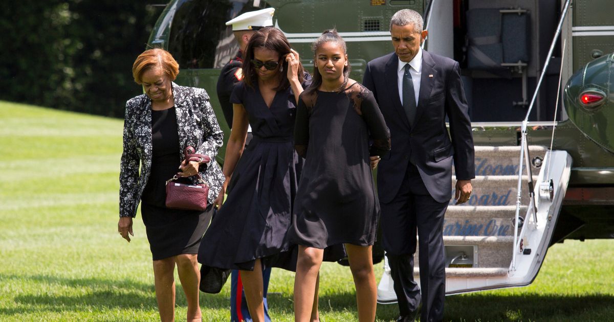 From left, Marian Robinson, first lady Michelle Obama, Sasha Obama and then-President Barack Obama exit Marine One and walk toward the residence of the White House on June 6, 2015, in Washington, D.C.