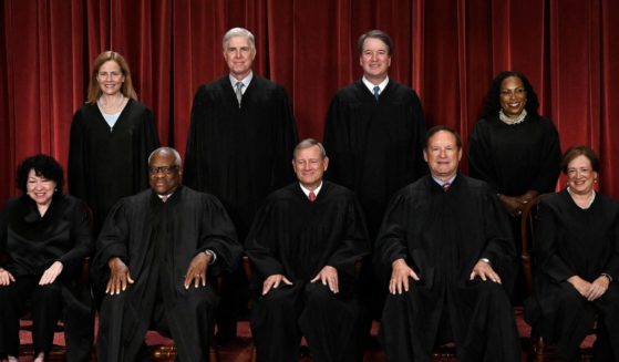 Justices of the US Supreme Court pose for their official photo at the Supreme Court in Washington, DC on October 7, 2022. (Seated from left) Associate Justice Sonia Sotomayor, Associate Justice Clarence Thomas, Chief Justice John Roberts, Associate Justice Samuel Alito and Associate Justice Elena Kagan, (Standing behind from left) Associate Justice Amy Coney Barrett, Associate Justice Neil Gorsuch, Associate Justice Brett Kavanaugh and Associate Justice Ketanji Brown Jackson.