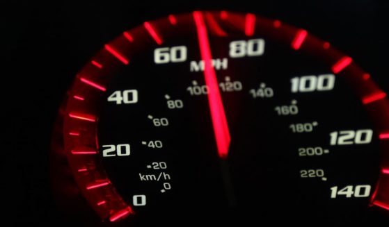 A stock photo shows a speedometer shows a car going about 70 mph.