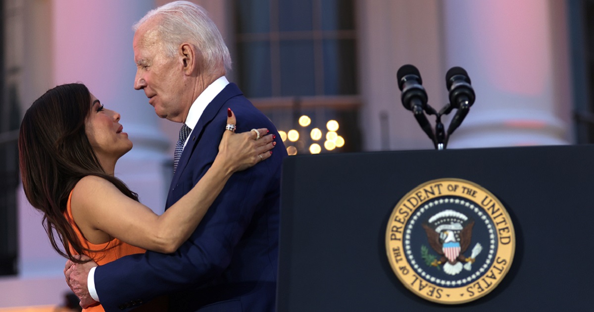 President Joe Biden hugs film director Eva Longoria during a screening of the film “Flamin’ Hot” on the South Lawn of the White House on June 15, 2023.