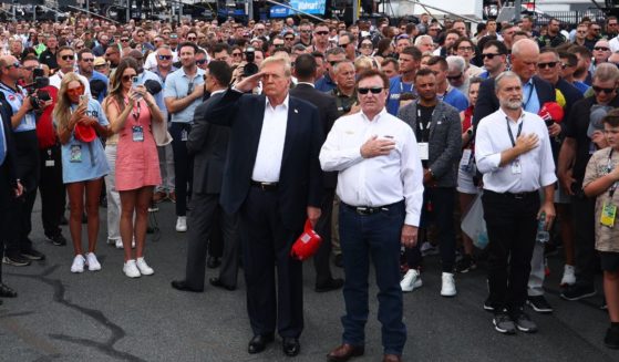 Former U.S. President and Republican presidential candidate Donald Trump stands on the grid with NASCAR team owner Richard Childress prior to the NASCAR Cup Series Coca-Cola 600 at Charlotte Motor Speedway on May 26, 2024 in Concord, North Carolina.