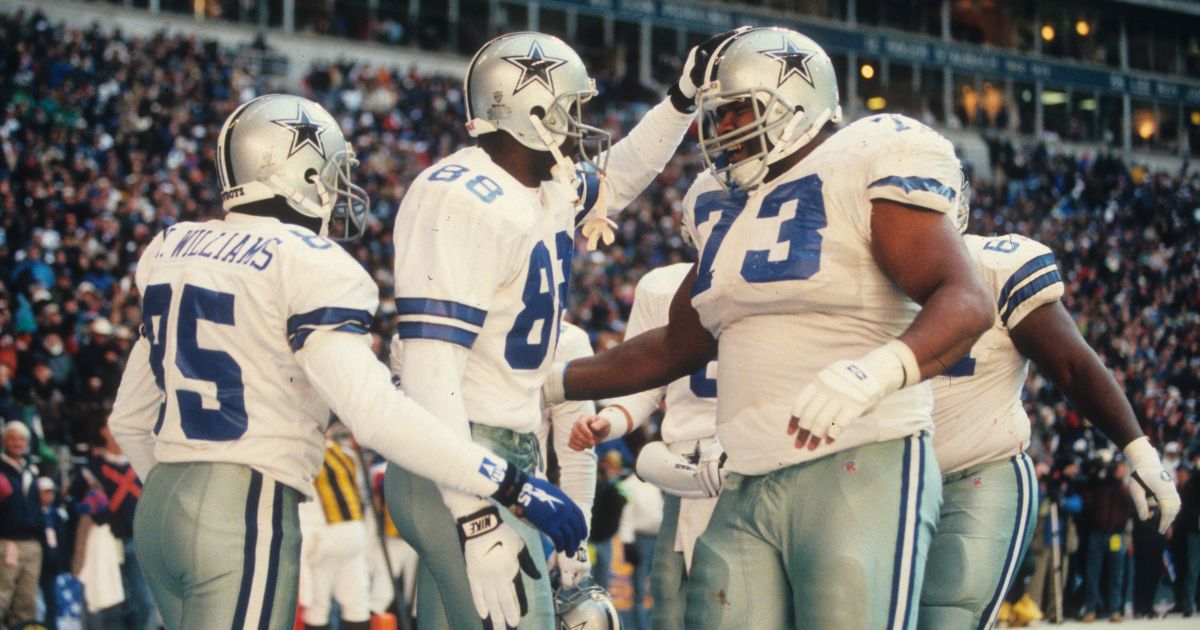 Dallas Cowboys wide receiver Michael Irvin, center, celebrates with lineman Larry Allen and wide receiver Kevin Williams after scoring against the Philadelphia Eagles in a playoff game at Texas Stadium in Irving on Jan. 7, 1996.