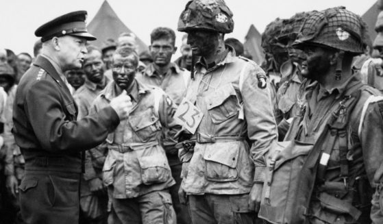 Allied Commander in Chief Gen. Dwight D. Eisenhower, left, speaks with American paratroopers at an undisclosed location in England, on June 6, 1944, prior to D-Day.