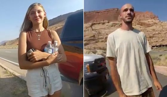 Gabrielle “Gabby” Petito, left, and Brian Laundrie are seen talking to an officer after police pulled over the van Laundrie was driving near the entrance to Arches National Park in Utah on Aug. 12, 2021.