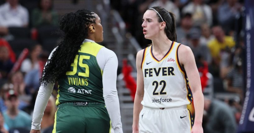 Caitlin Clark #22 of the Indiana Fever exchanges words with Victoria Vivians #35 of the Seattle Storm during the first quarter in the game at Gainbridge Fieldhouse on May 30, 2024 in Indianapolis, Indiana.