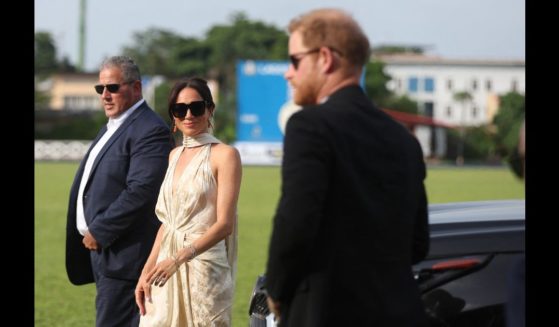Britain's Meghan (C), Duchess of Sussex, and Britain's Prince Harry (R), Duke of Sussex, arrive at a charity polo game at the Ikoyi Polo Club in Lagos on May 12, 2024 as they visit Nigeria as part of celebrations of Invictus Games anniversary.
