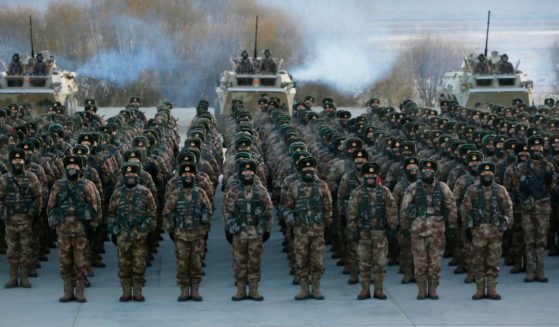 This photo taken on January 4, 2021 shows Chinese People's Liberation Army (PLA) soldiers assembling during military training at Pamir Mountains in Kashgar, northwestern China's Xinjiang region.
