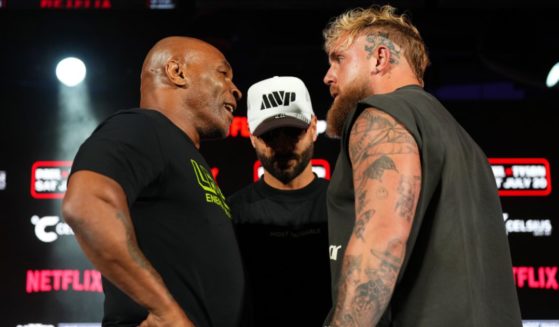 (L-R) Mike Tyson, Nakisa Bidarian and Jake Paul pose onstage during the Jake Paul vs. Mike Tyson Boxing match Arlington press conference at Texas Live! on May 16, 2024 in Arlington, Texas.