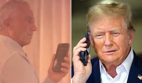 Former President Donald Trump, right, seen in a file photo from May, spoke with independent presidential candidate Robert F. Kennedy, left, about his conversation with President Joe Biden after Saturday's assassination attempt on Trump.