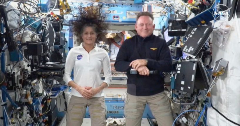 NASA astronauts Suni Williams, left, and Butch Wilmore, right, participate in a news conference from the International Space Station on Sept. 13.
