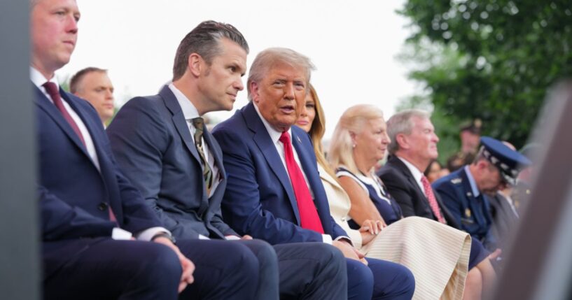 Defense Secretary Pete Hegseth and President Donald Trump look on during the celebration of the Army's 250th birthday on the National Mall on June 14, 2025, in Washington, D.C.