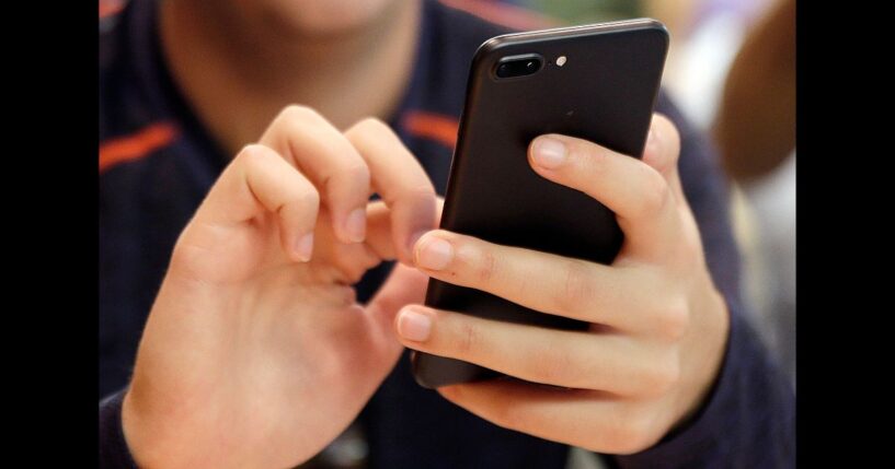 In this Friday, Sept. 16, 2017, file photo, a person uses a smart phone in Chicago.
