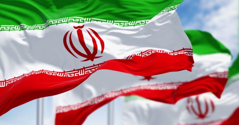 Three Iranian flags are waving in the breeze in this 3D illustration.