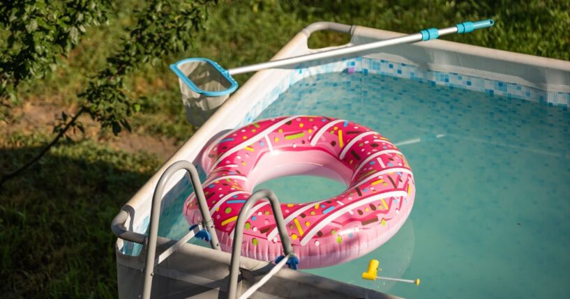 In this stock photo, an above ground pool is pictured in a backyard.