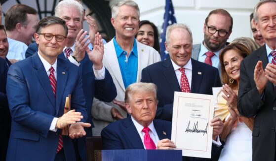 U.S. President Donald Trump, joined by Republican lawmakers, signs the One, Big Beautiful Bill Act into law during an Independence Day military family picnic on the South Lawn of the White House on July 4, 2025 in Washington, DC.