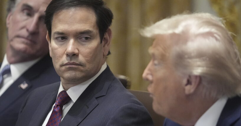 President Donald Trump speaks during a cabinet meeting, Tuesday, Aug. 26, 2025, at the White House in Washington, as from left, Secretary of Interior Doug Burgum and Secretary of State Marco Rubio, look on.