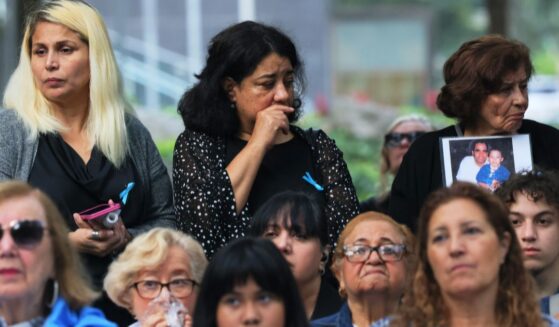 Families of the victims of the 9/11 terror attack listen as names are read during the annual 9/11 Commemoration Ceremony at the National 9/11 Memorial and Museum in New York City on Sept. 11, 2023.