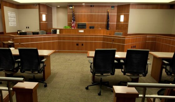 This stock image shows a modern courtroom setting from the gallery's point-of-view.