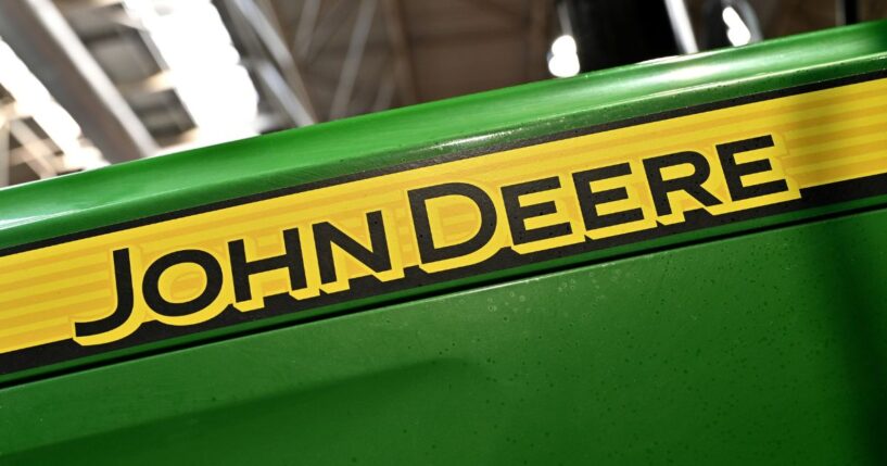 The company logo of agricultural machinery tractor manufacturer John Deere is displayed during the LAMMA Show 2025 in Birmingham, England, on Jan. 15.