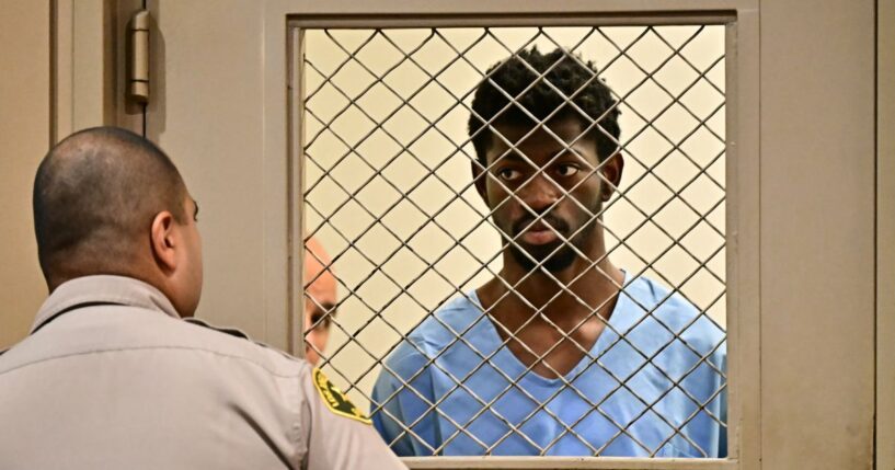 Rapper Lil Nas X, right, looks on at the conclusion of his arraignment at Los Angeles Superior Court in Van Nuys, California, on Monday.