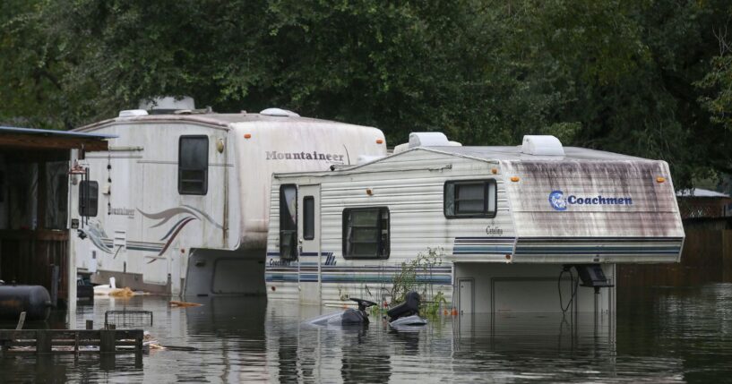 A flooded RV sits in the flood waters on highway 124 on Sept. 20, 2019, in Beaumont, Texas.